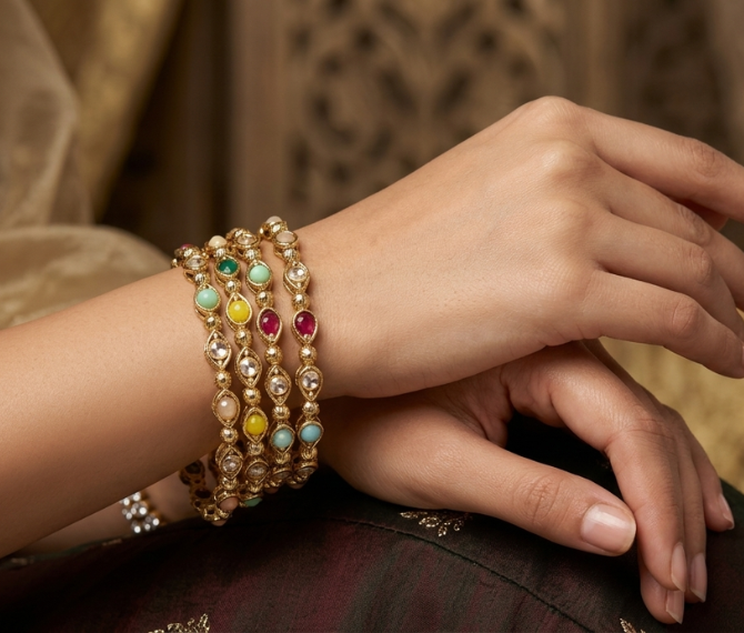 Four antique gold multicolour stone studded kangan